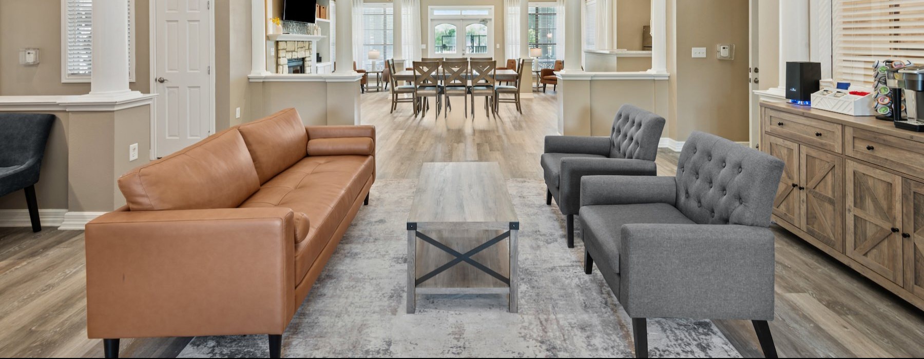 a clubroom with a couch and chairs