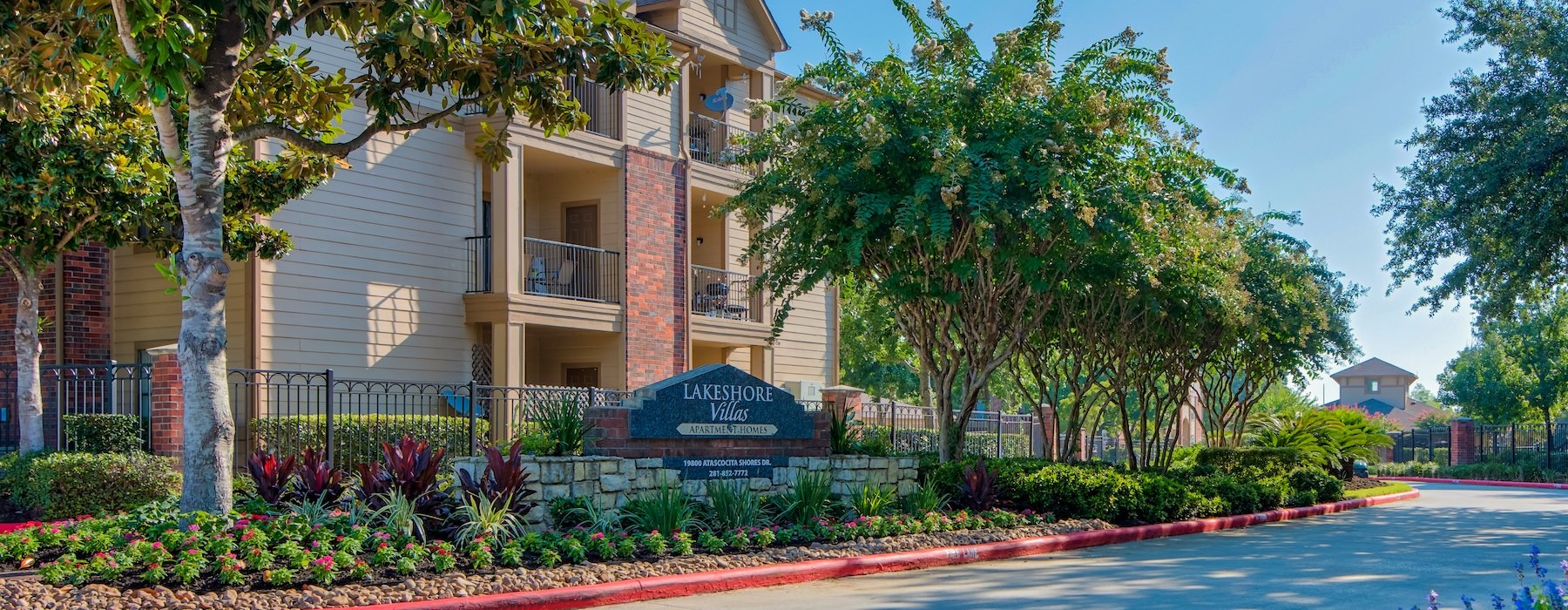 a building with trees and flowers