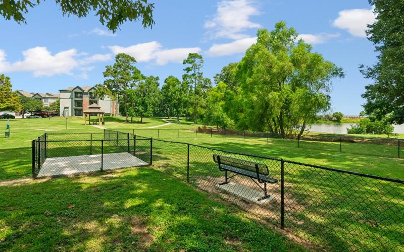 a dog park with a bench